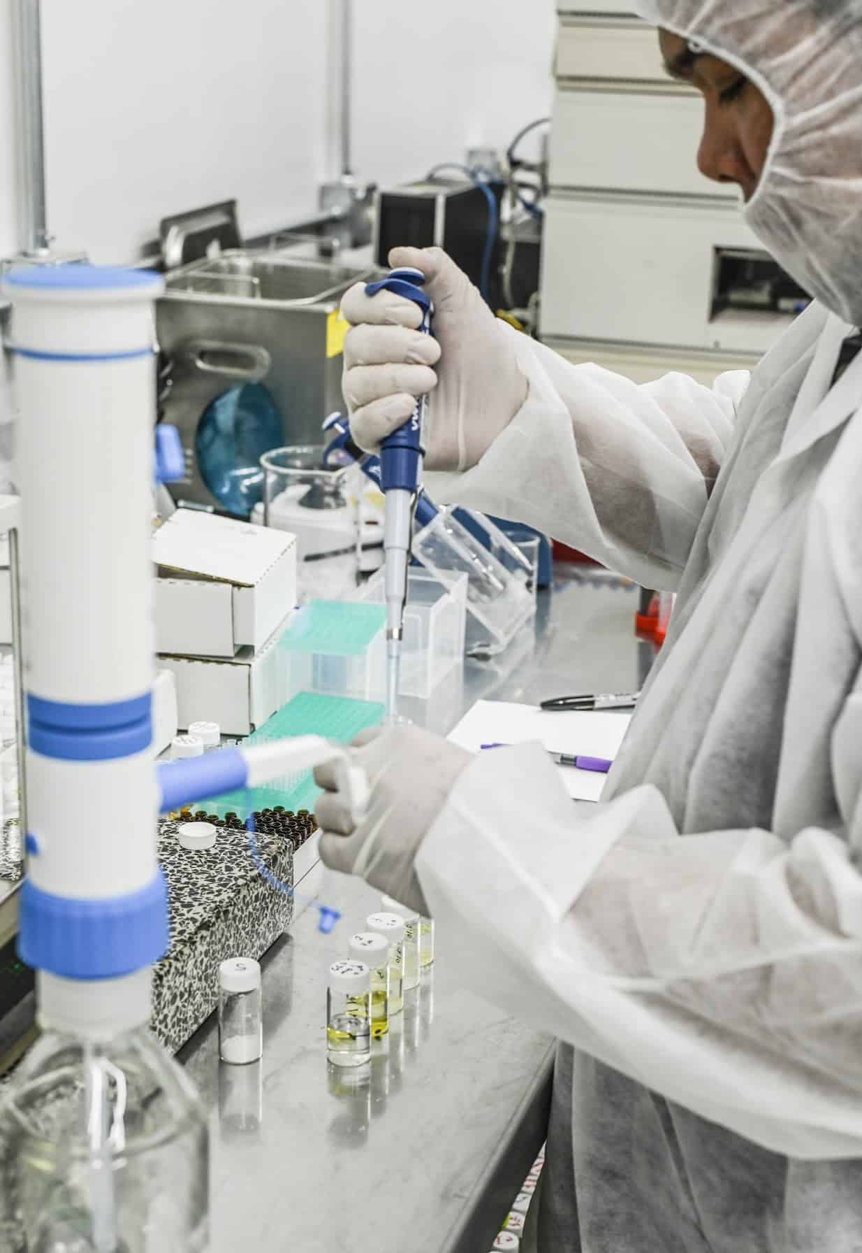 scientist using chromatography equipment