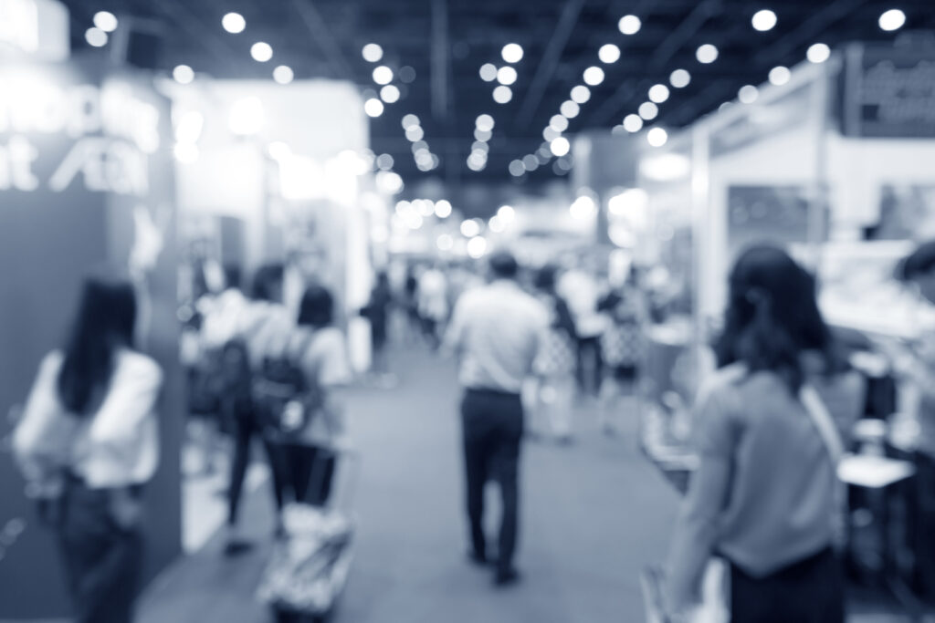 abstract blurred event exhibition with people background, business convention show concept