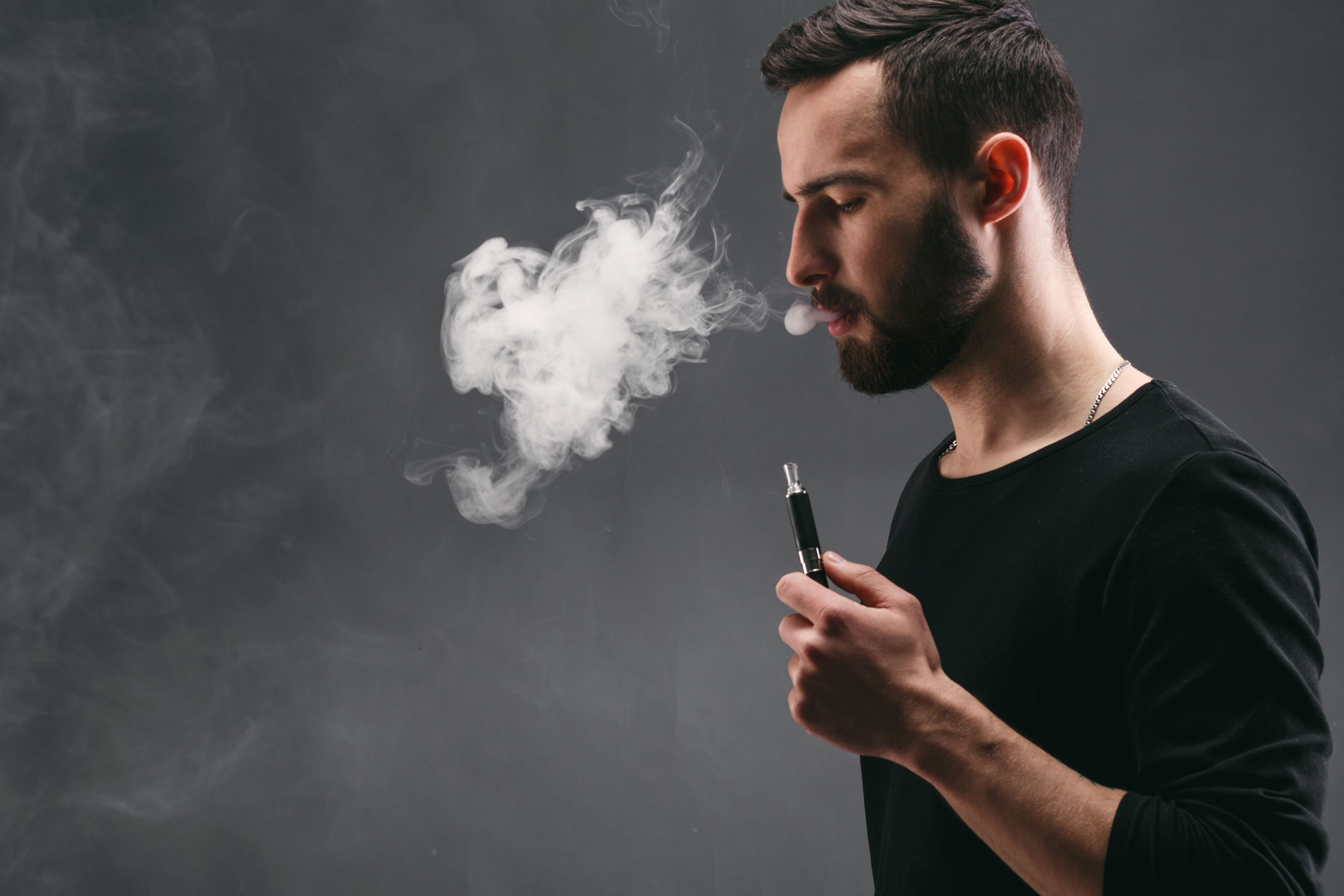man vape smoke inhale
