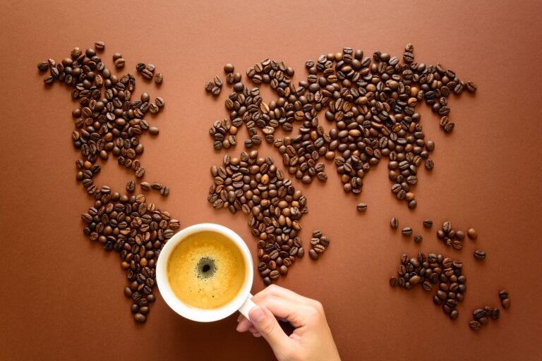coffee beans and a cup of coffee on a table